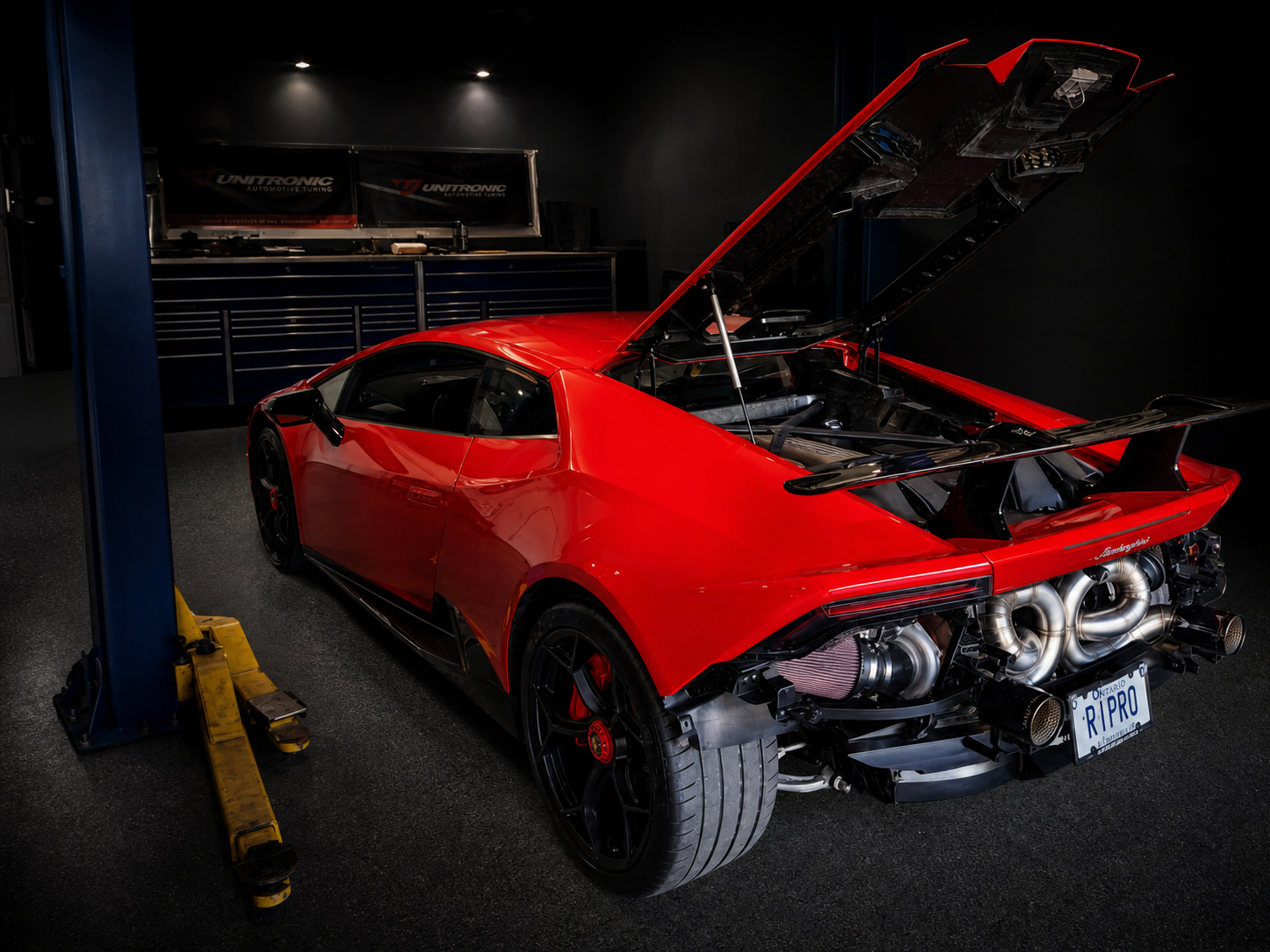 Red Lamborghini Huracan editorial detail inside the JA Tuning shop