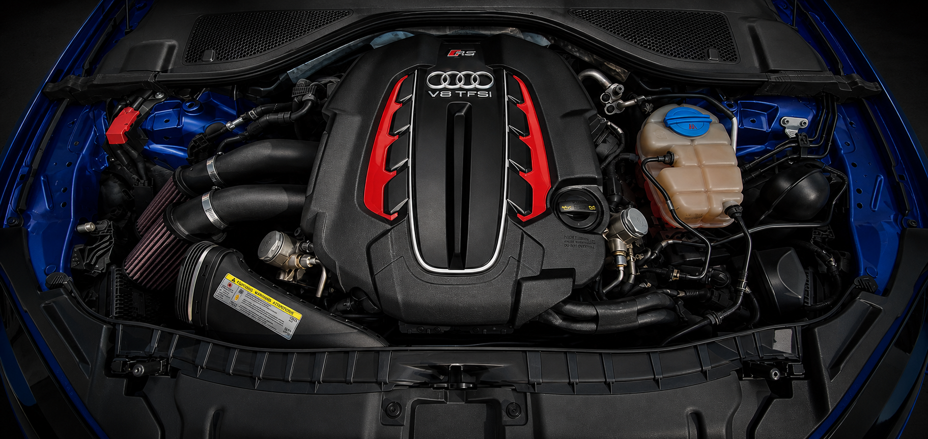 Audi RS engine bay with visible performance intake hardware